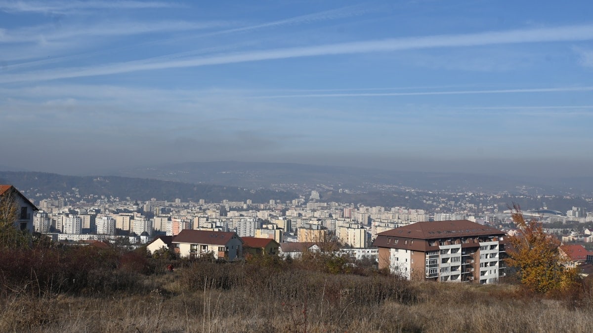 A distant city view under a clear sky.